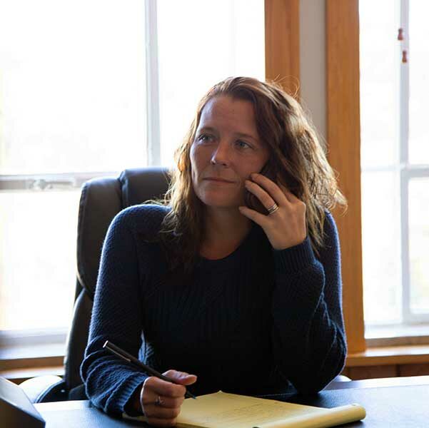 North Carolina Criminal Law Paralegal Vanessa Sprouse on the phone at her desk.